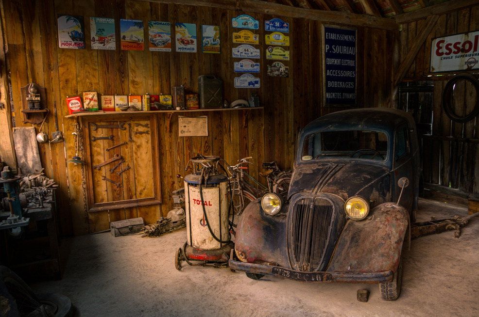 Old and Rusted Vintage Car in a Garage